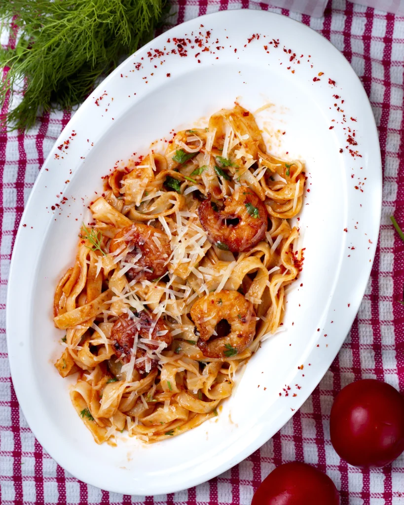 Simmering Bolognese sauce with fresh ingredients in a cozy kitchen.